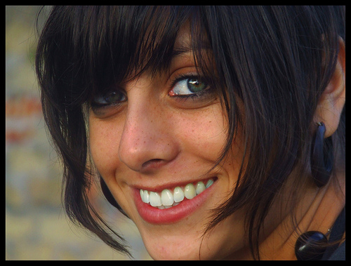 A close up portrait showing how using shallow depth of field photography can totally eliminate distracting background detail focusing the viewer's attention on the subject's face