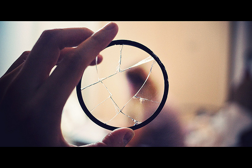 Image showing a broken UV filter - which stopped a lens being damaged