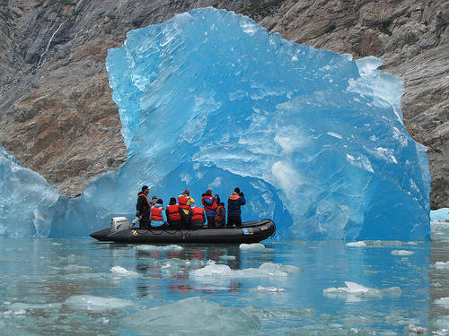 A photograph of a rare, blue iceberg illustrating the refraction of light