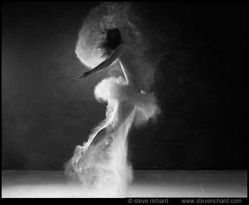 Contemporary art photography by Steve Richard (Image #24 from the 'Cloud Busting' series) A female dancer in clouds of dust in black and white